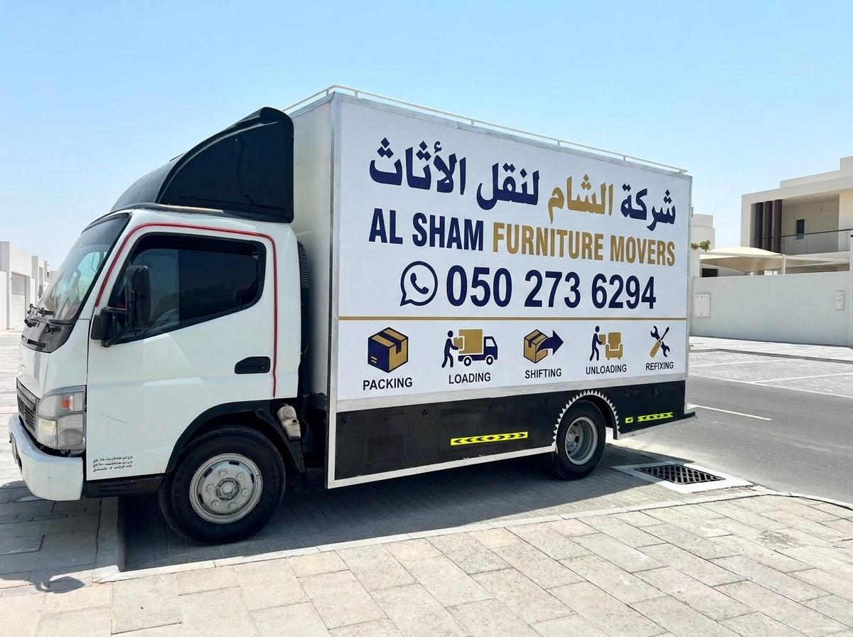 Al Sham Movers team loading a moving truck in Sharjah